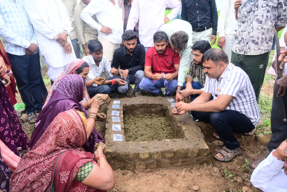 BRC members in an Indian village field preparing a natural farming input during a hands-on demonstration